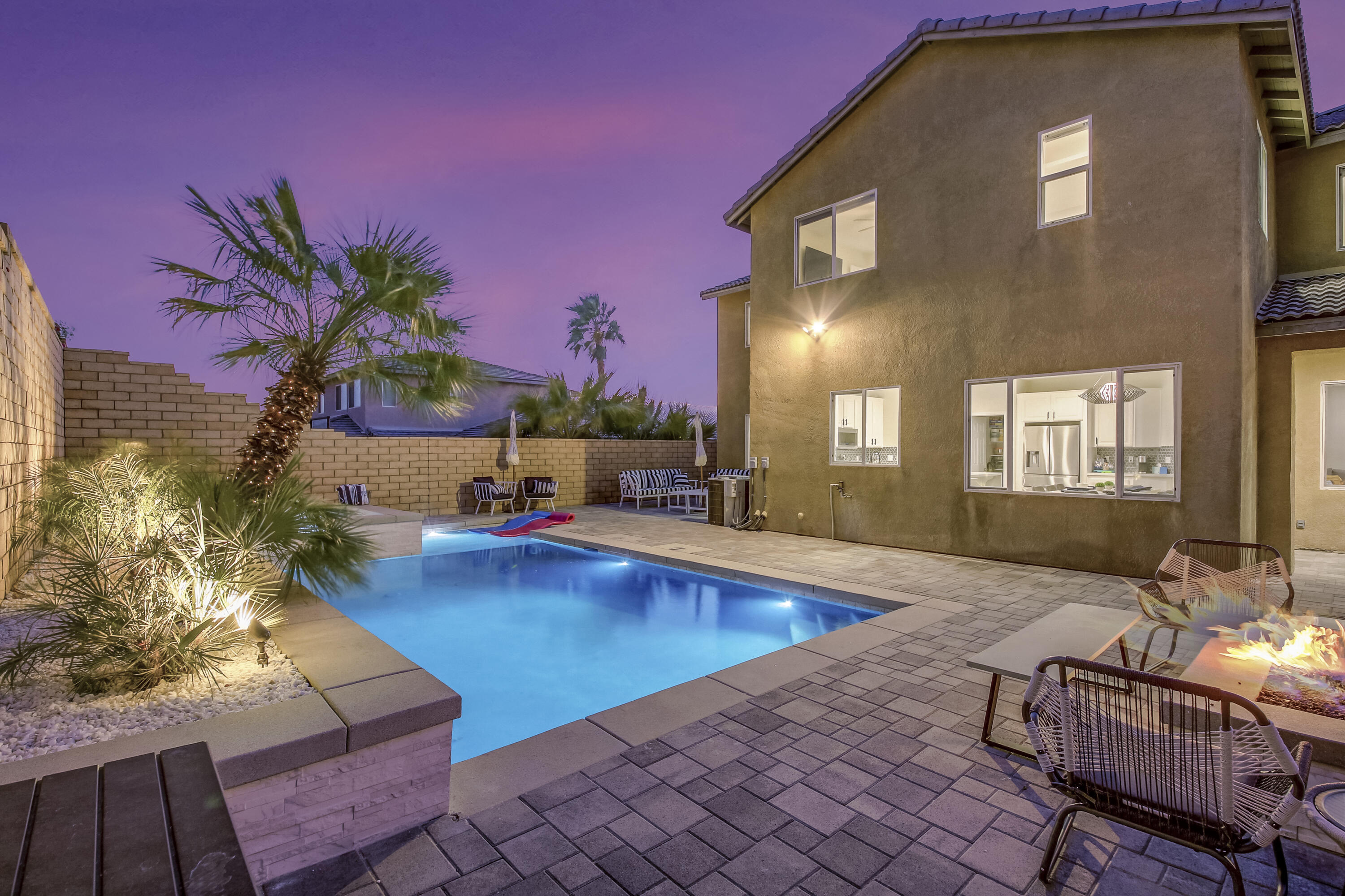 42942 Del Lago Court Indio, CA 92203 - Photo 48 of 75 a view of a swimming pool with lounge chairs