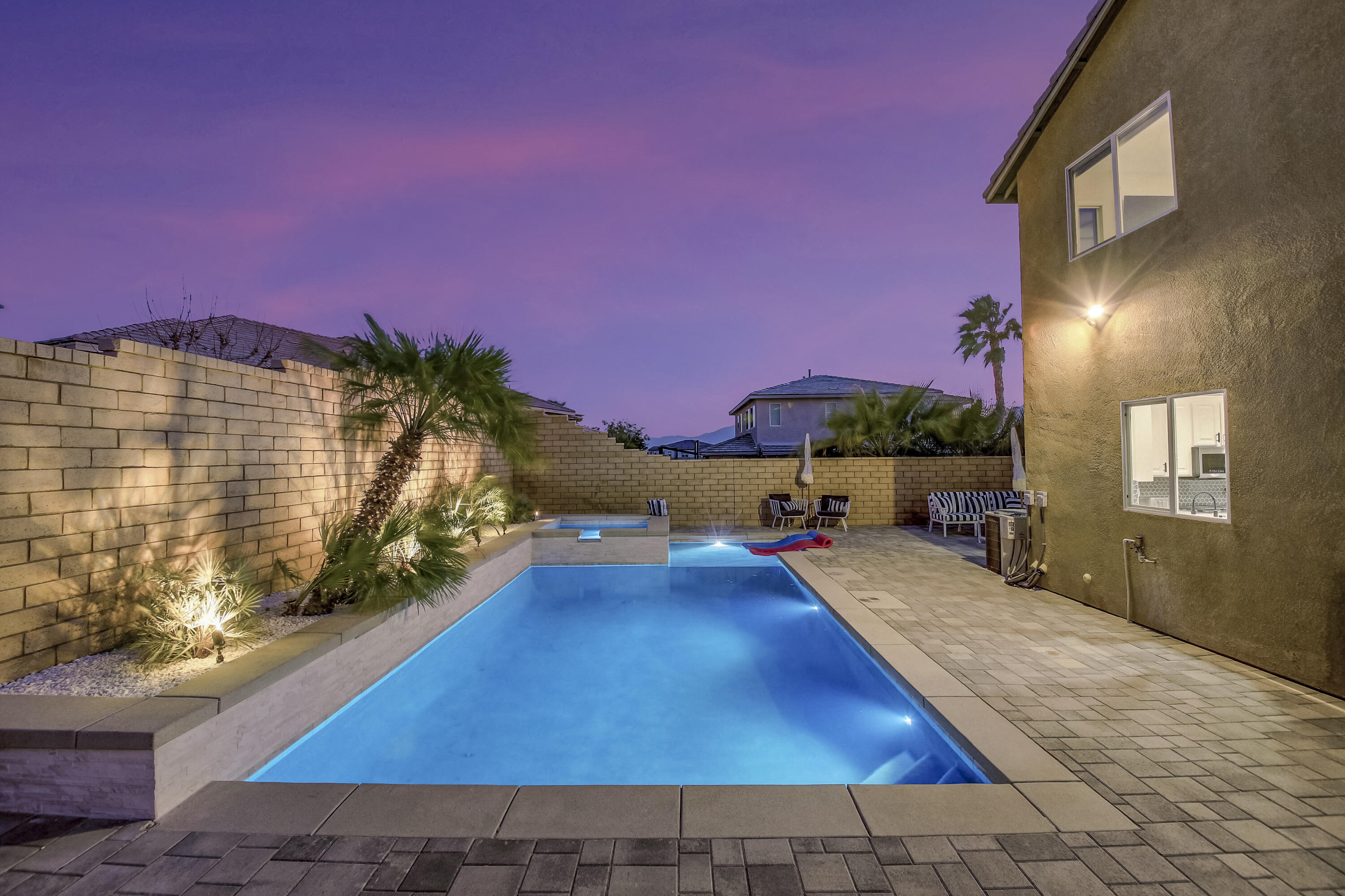 42942 Del Lago Court Indio, CA 92203 - Photo 49 of 75 a view of a swimming pool with an outdoor space and seating area