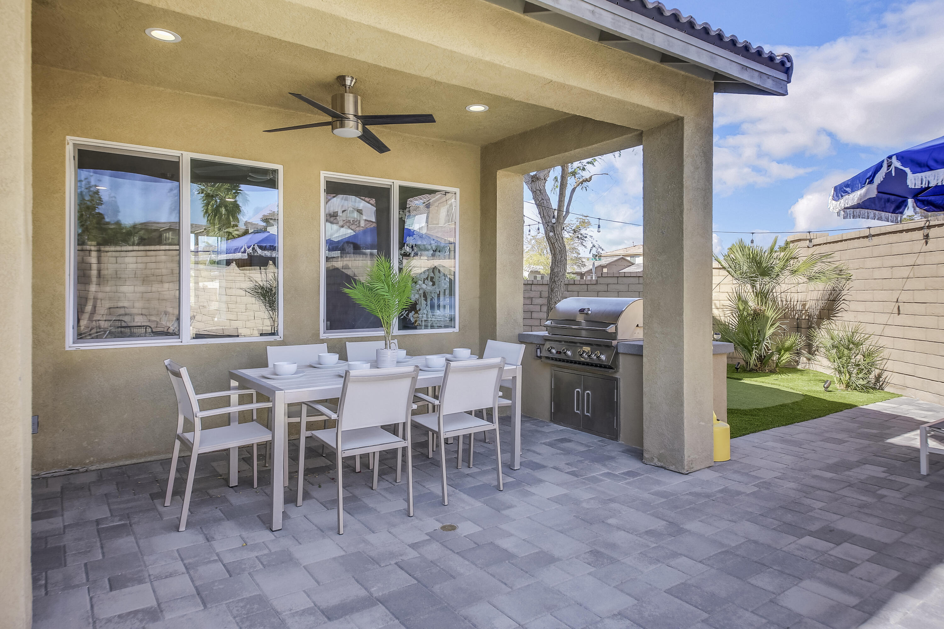 42942 Del Lago Court Indio, CA 92203 - Photo 51 of 75 a dining room with furniture a chandelier and a rug