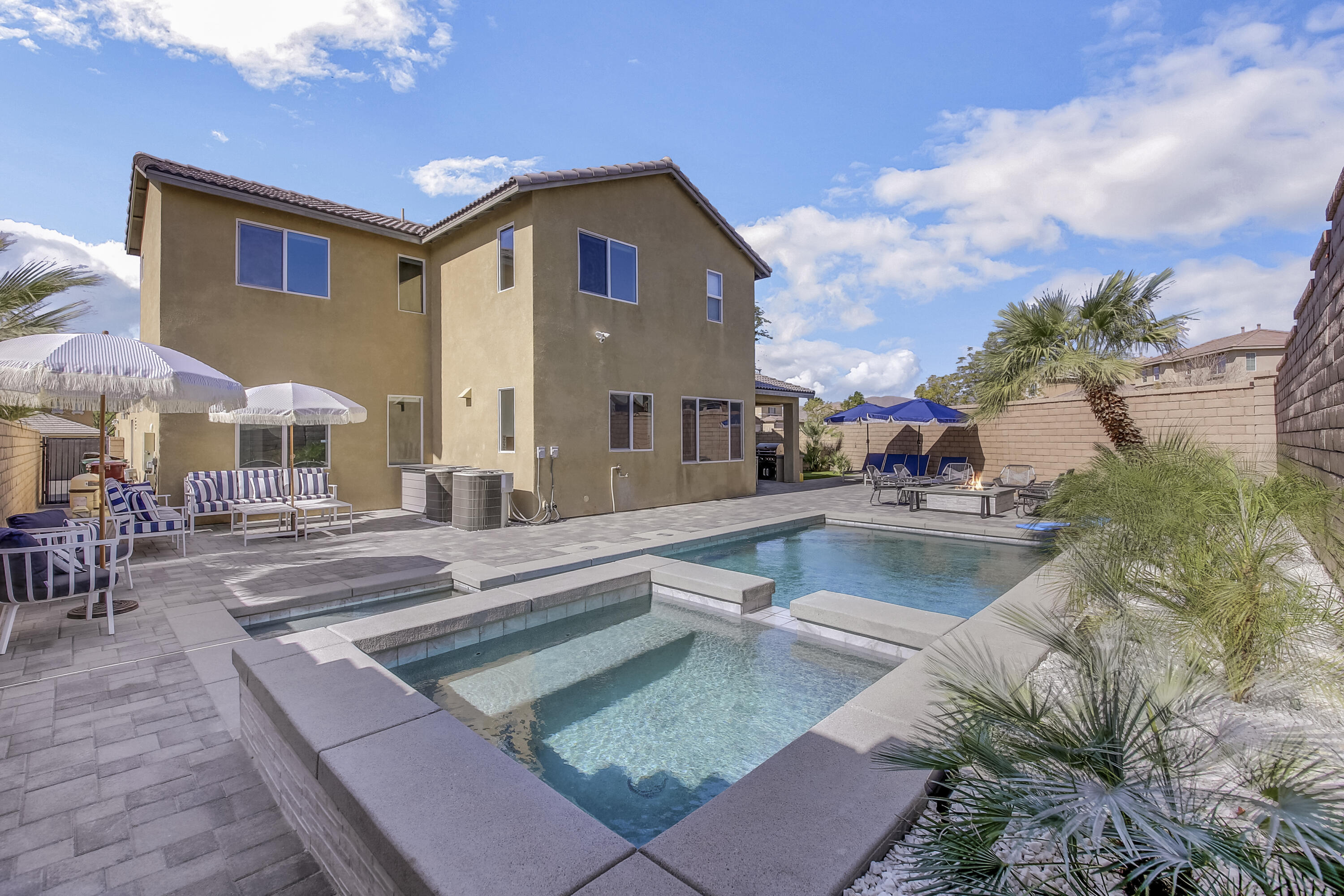 42942 Del Lago Court Indio, CA 92203 - Photo 57 of 75 a view of a house with swimming pool and sitting area