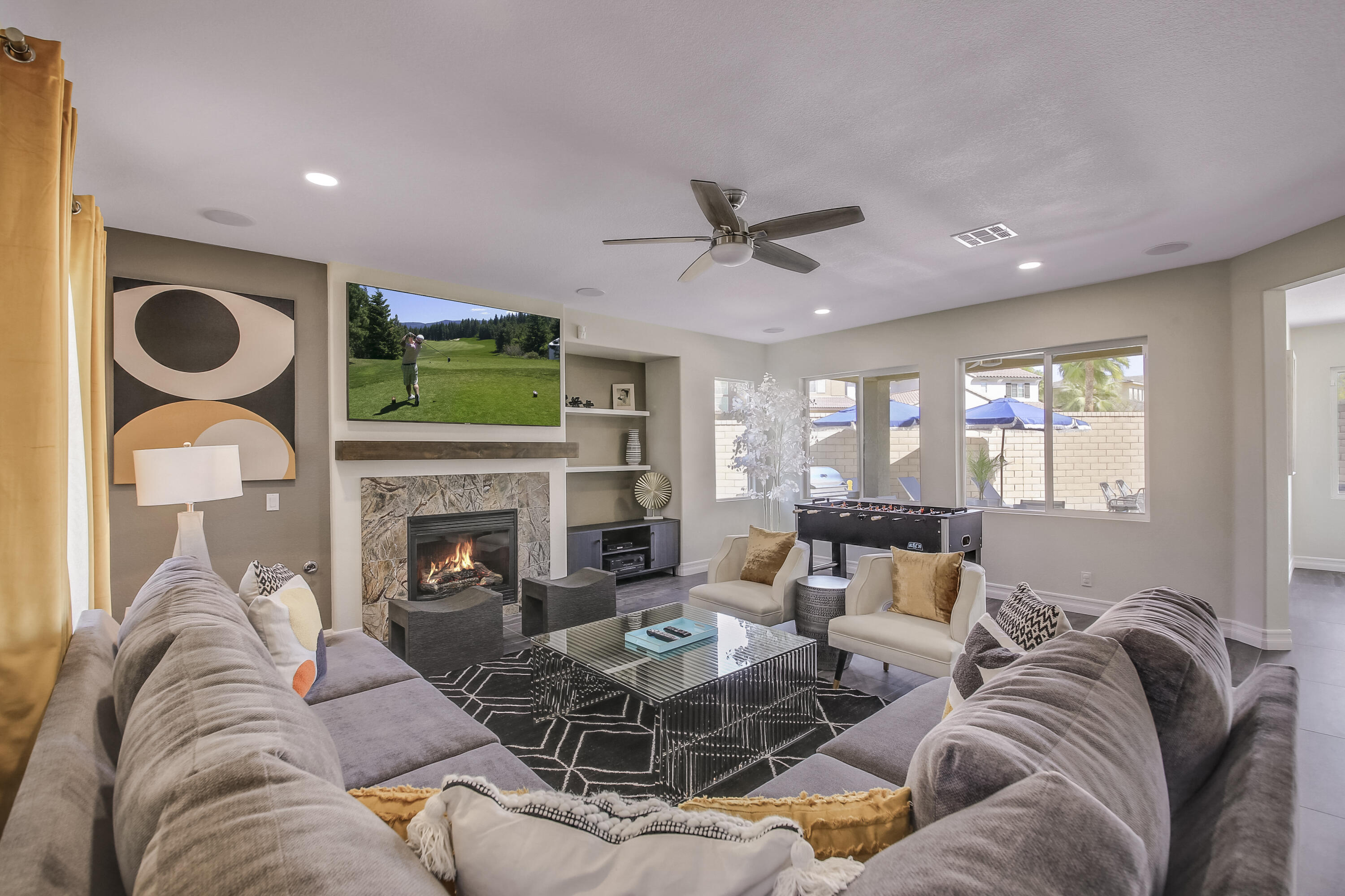 42942 Del Lago Court Indio, CA 92203 - Photo 8 of 75 a living room with furniture a fireplace and a flat screen tv