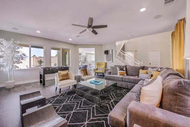 a large kitchen with stainless steel appliances kitchen island granite countertop a sink and cabinets