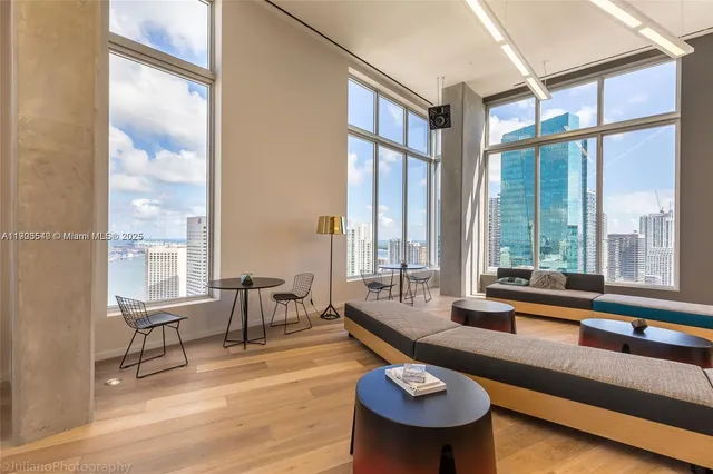 a room with lots of furniture and windows