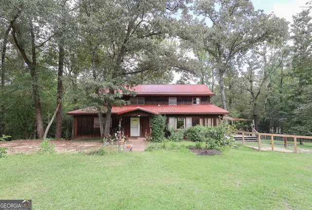 a view of a table and chairs under an umbrella