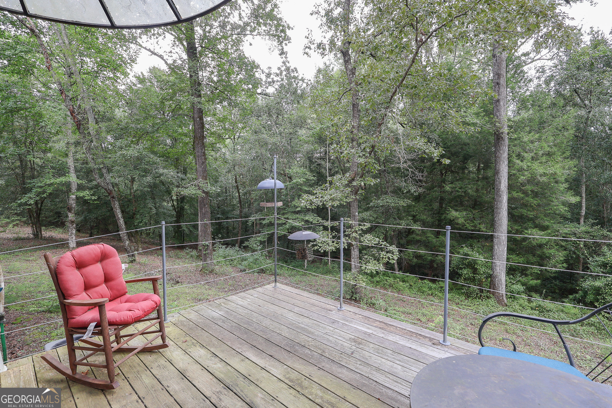 299 Chapman Road Lizella, GA 31052 - Photo 17 of 21 a view of a chairs in a balcony