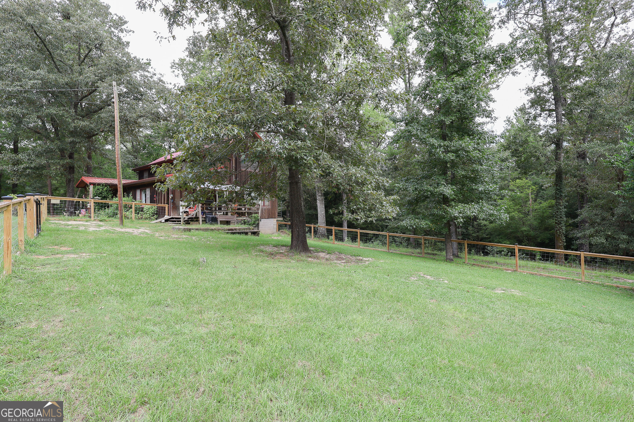 299 Chapman Road Lizella, GA 31052 - Photo 19 of 21 a view of a park with large trees