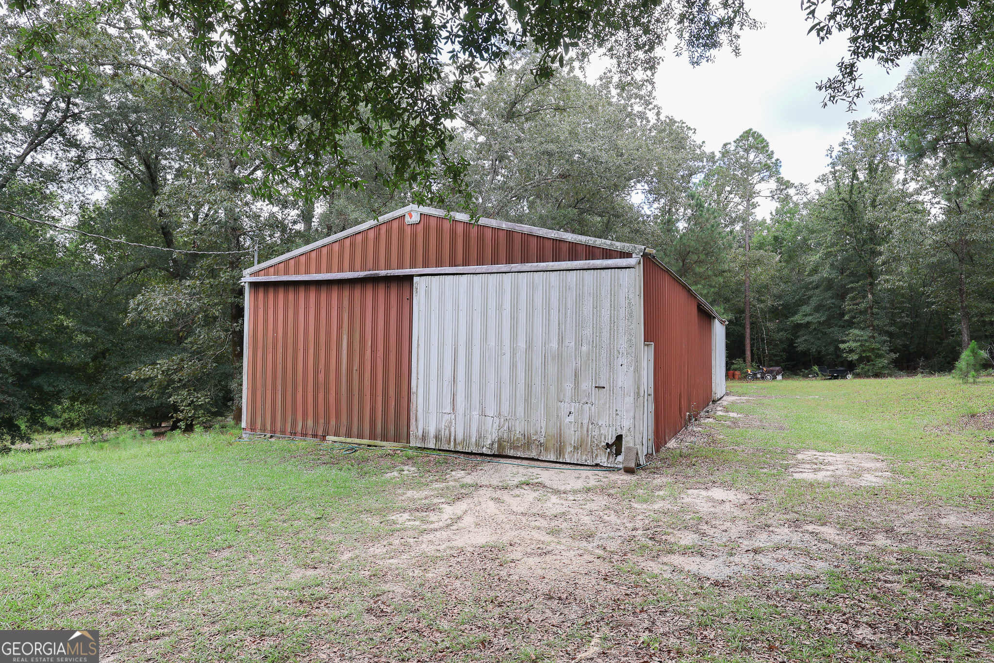 299 Chapman Road Lizella, GA 31052 - Photo 20 of 21 a view of barn with a small yard