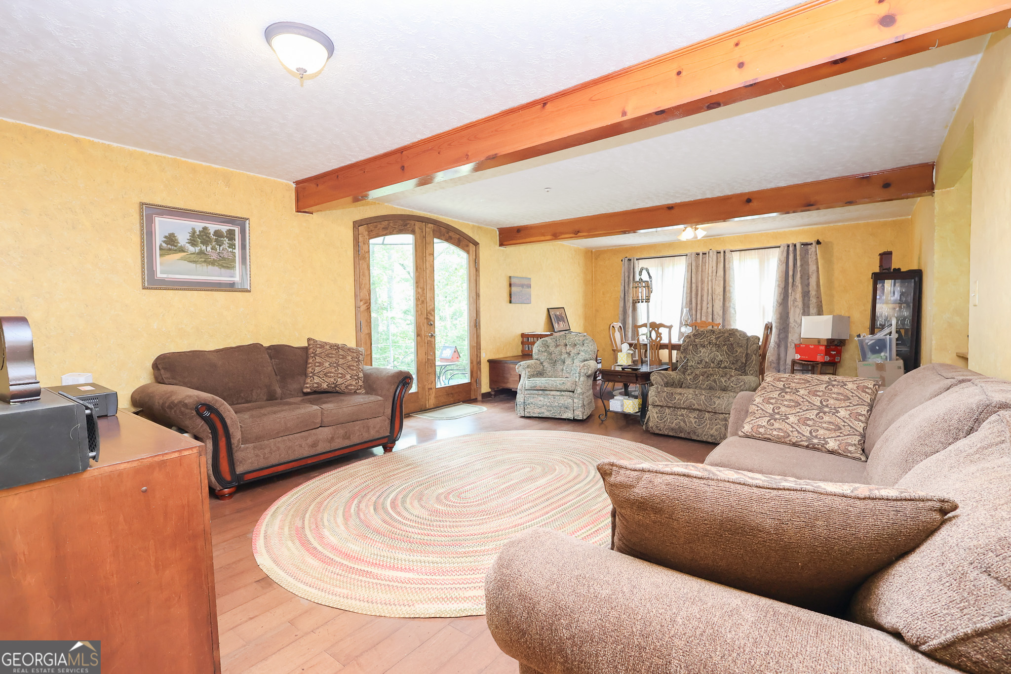 299 Chapman Road Lizella, GA 31052 - Photo 4 of 21 a living room with furniture and a large window