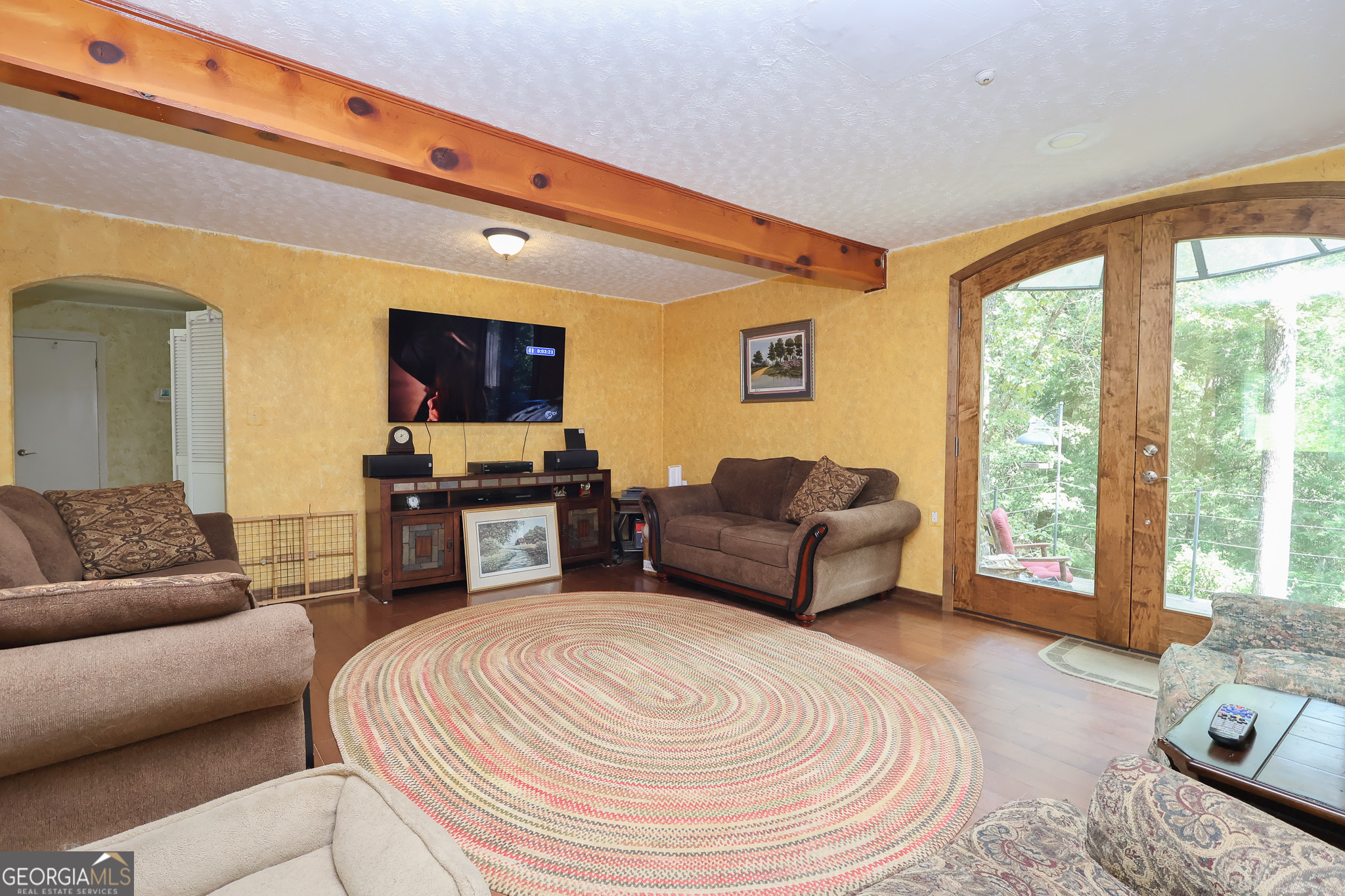 299 Chapman Road Lizella, GA 31052 - Photo 5 of 21 a living room with furniture and a flat screen tv