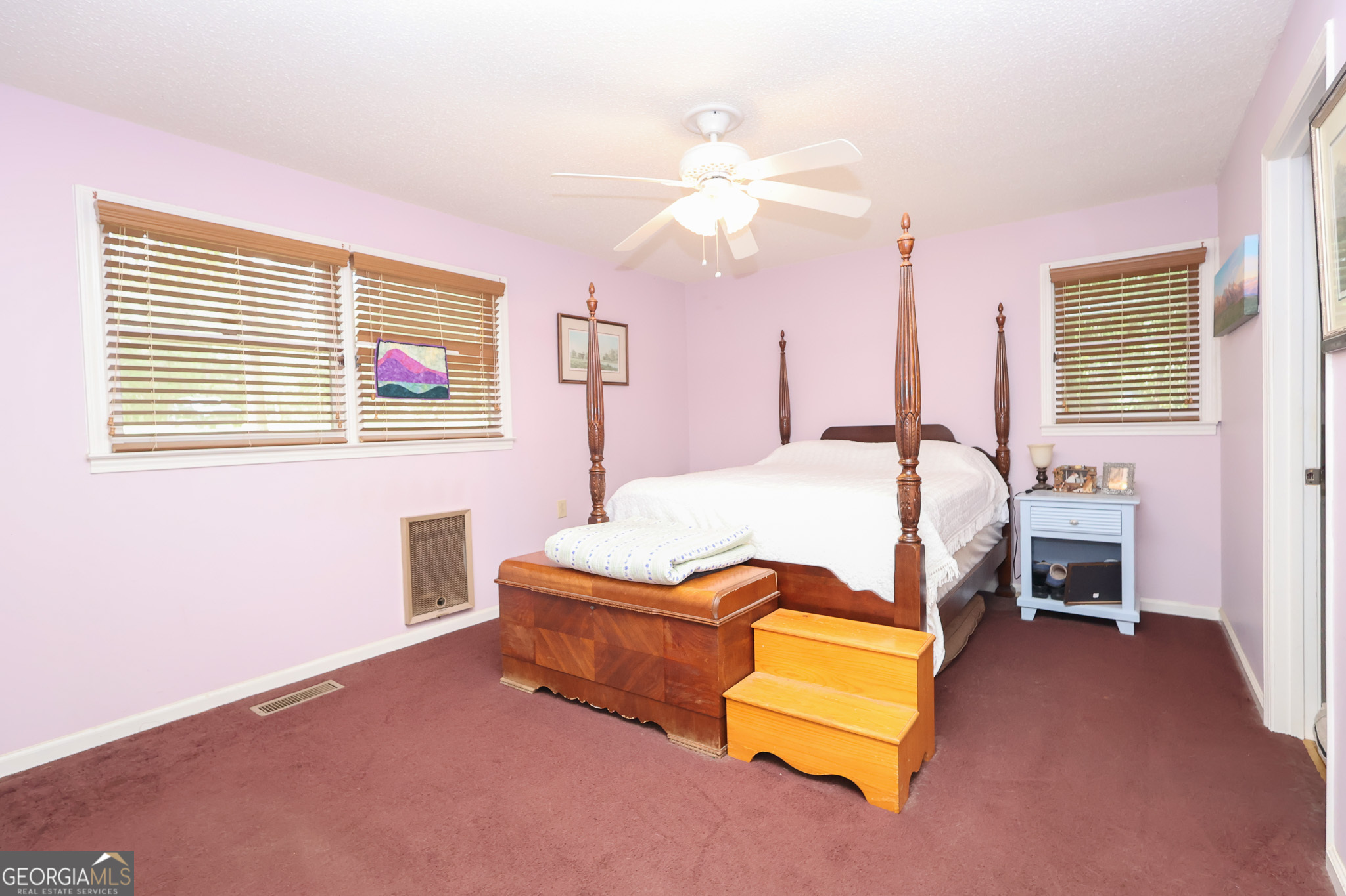 299 Chapman Road Lizella, GA 31052 - Photo 10 of 21 a bedroom with a bed couch and a window