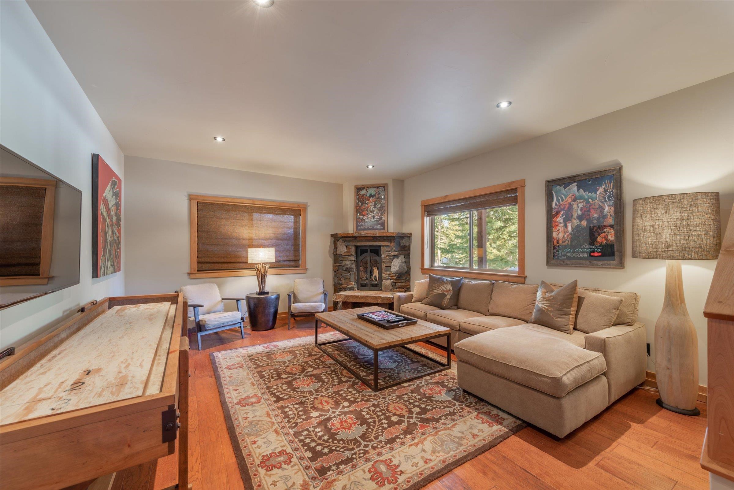 12968 Solvang Way Truckee, CA 96161 - Photo 13 of 21 a living room with furniture flat screen tv and window
