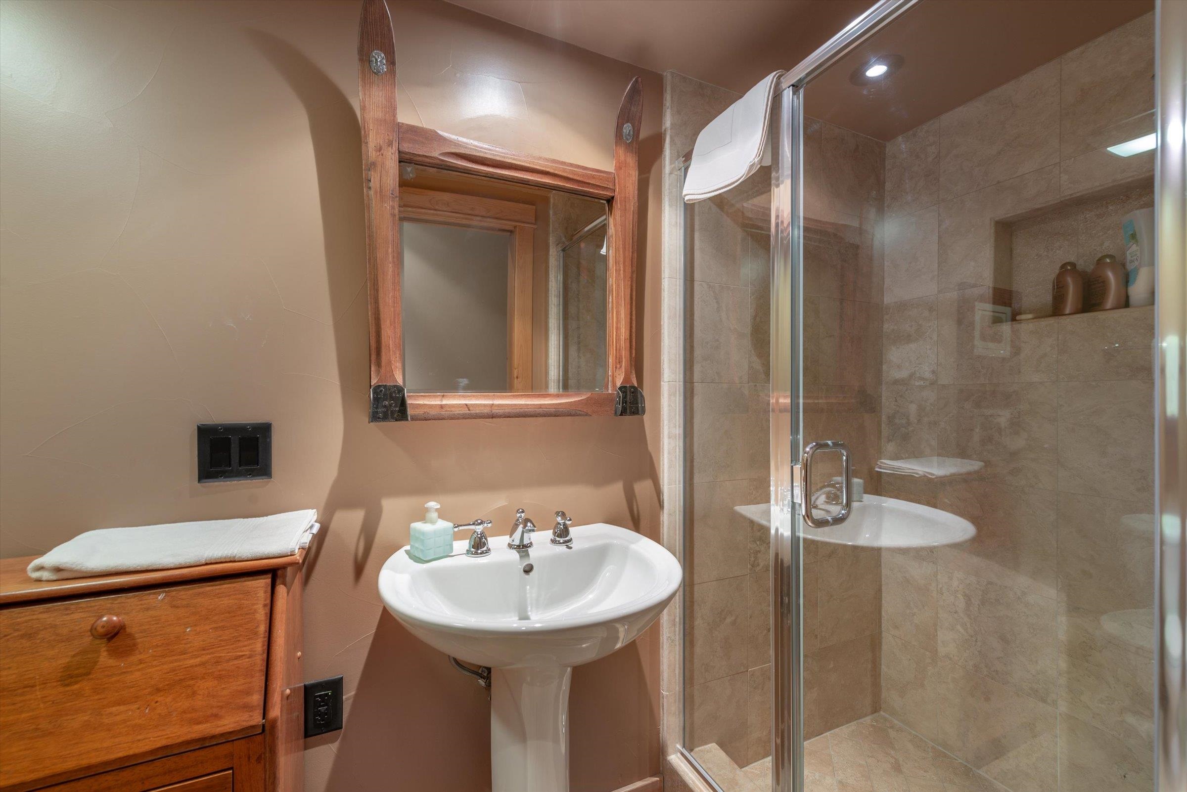 12968 Solvang Way Truckee, CA 96161 - Photo 17 of 21 a bathroom with a sink a toilet and shower