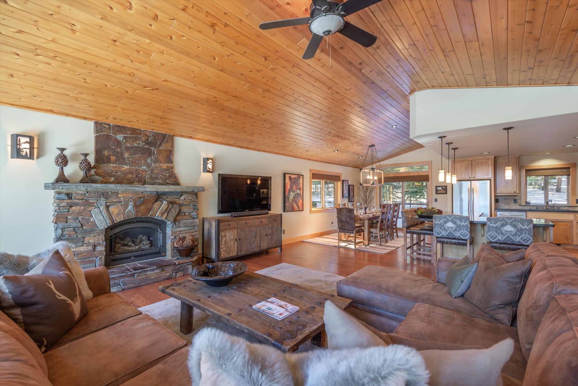 12968 Solvang Way Truckee, CA 96161 - Photo 3 of 21 a living room with furniture a fireplace and a flat screen tv