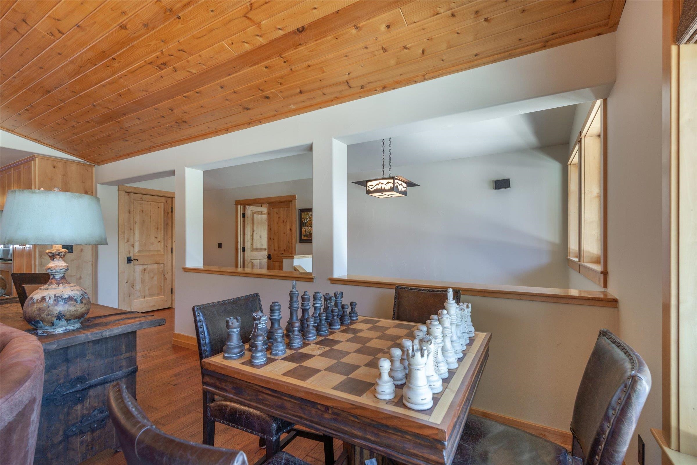 12968 Solvang Way Truckee, CA 96161 - Photo 4 of 21 a view of a dining room with furniture and wooden floor