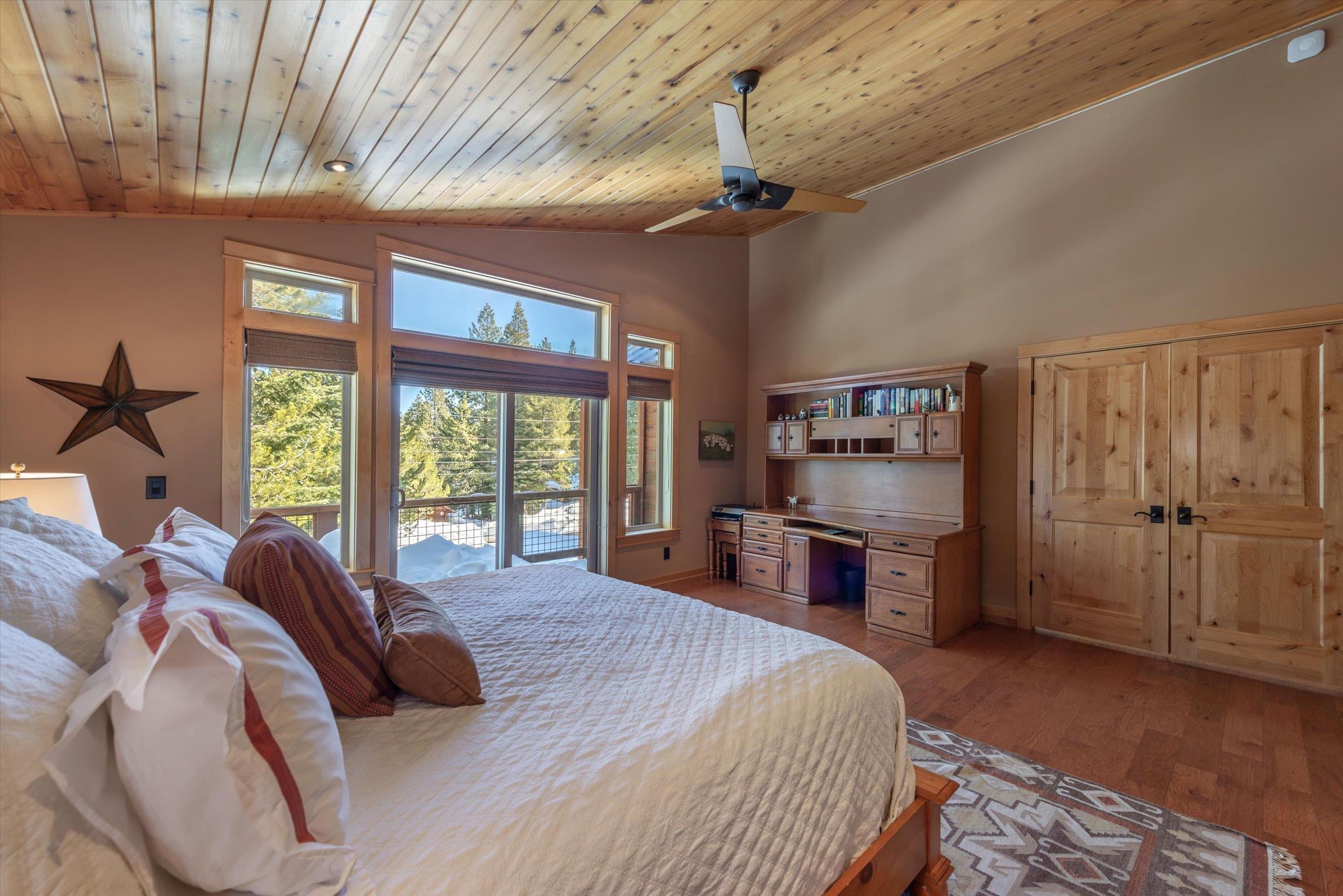 12968 Solvang Way Truckee, CA 96161 - Photo 8 of 21 a bedroom with a large bed and a large window