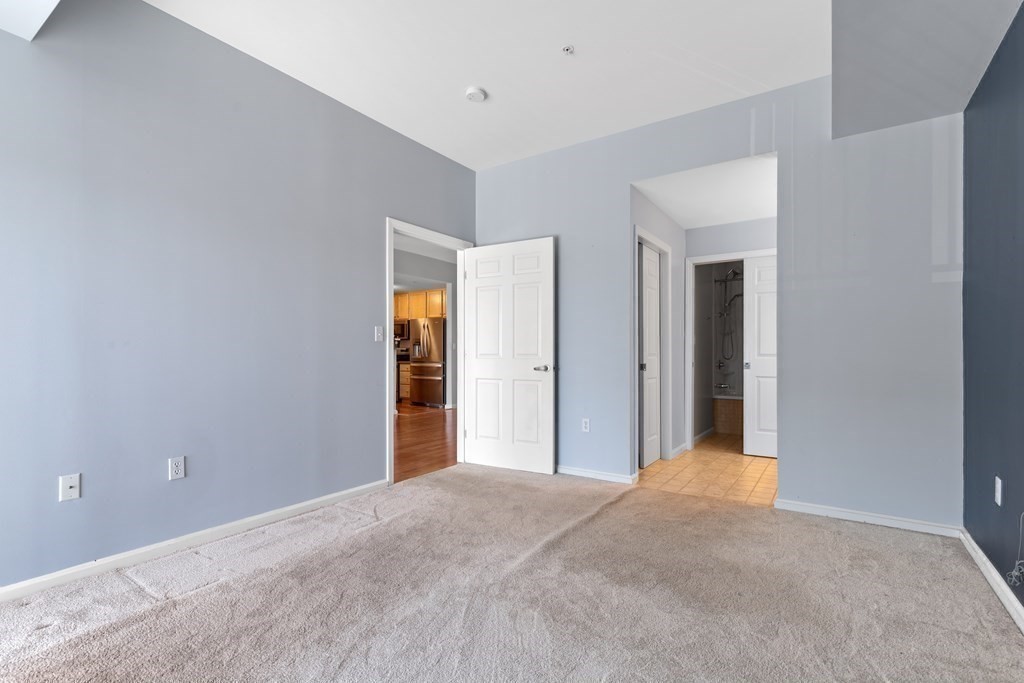 36 Village Road, Unit 306 Middleton, MA 01949 - Photo 17 of 38 a view of a livingroom with an empty space