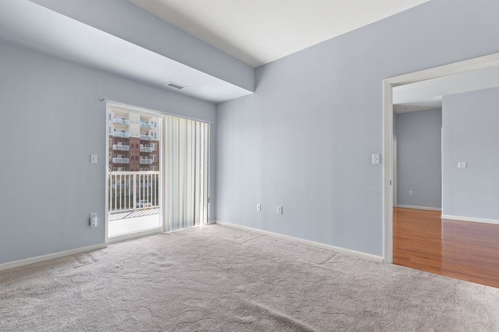 36 Village Road, Unit 306 Middleton, MA 01949 - Photo 18 of 38 a view of an empty room with a window