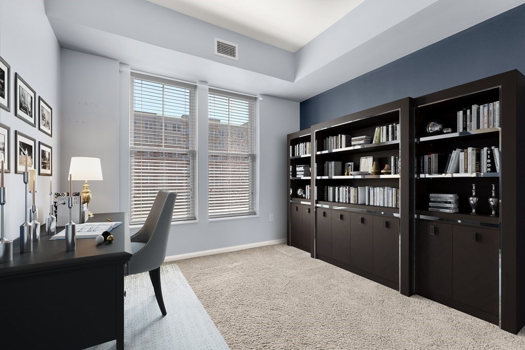 36 Village Road, Unit 306 Middleton, MA 01949 - Photo 27 of 38 a bedroom with furniture and a book shelf