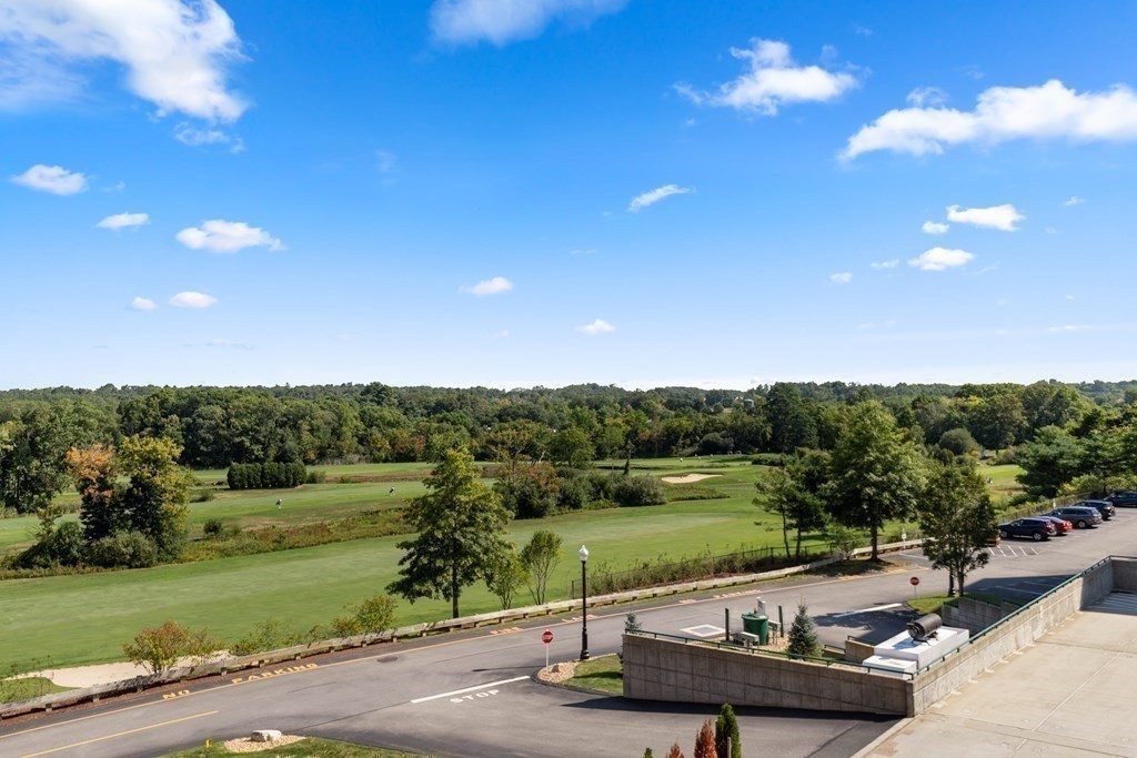 36 Village Road, Unit 306 Middleton, MA 01949 - Photo 29 of 38 a view of a lake with a yard