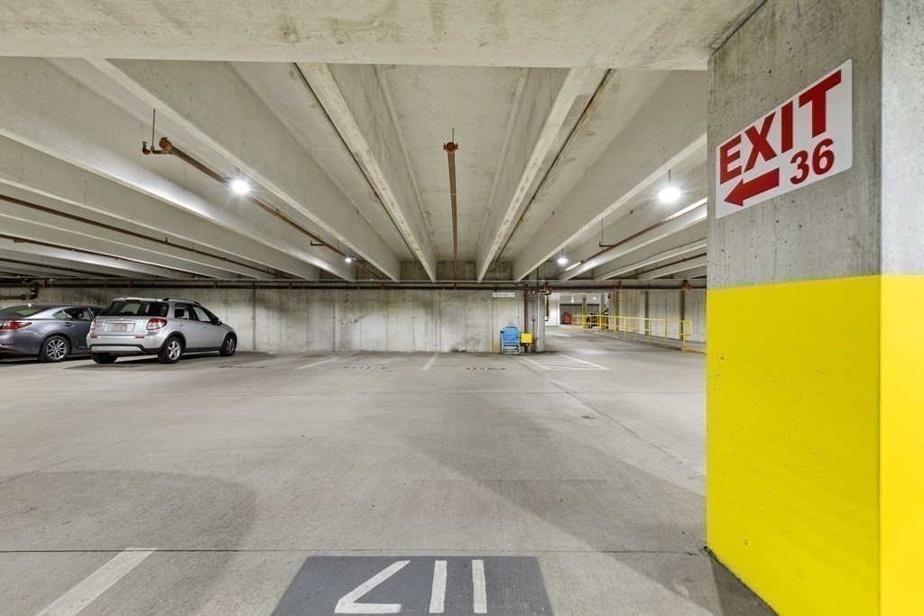 36 Village Road, Unit 306 Middleton, MA 01949 - Photo 30 of 38 a view of parking garage with cars