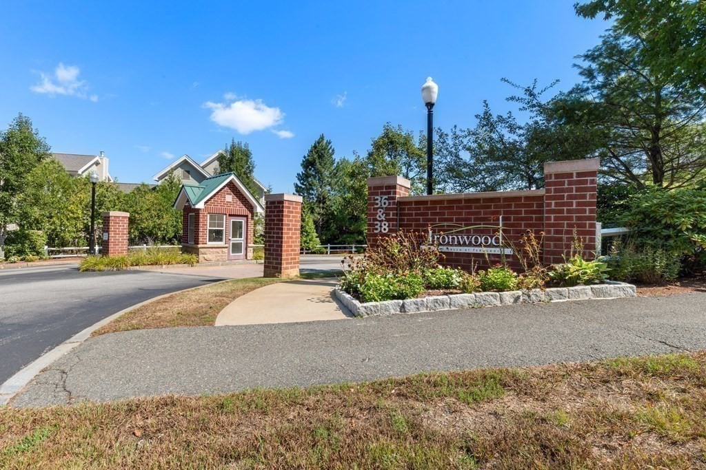 36 Village Road, Unit 306 Middleton, MA 01949 - Photo 35 of 38 a front view of a house with a yard and outdoor space