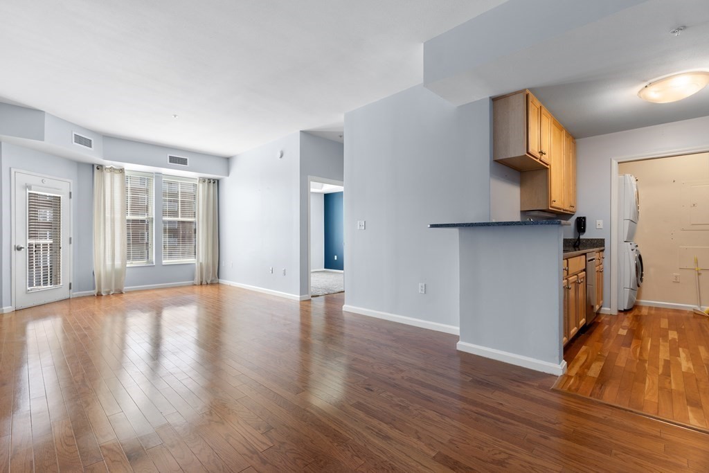 36 Village Road, Unit 306 Middleton, MA 01949 - Photo 6 of 38 a view of a kitchen with wooden floor and a kitchen