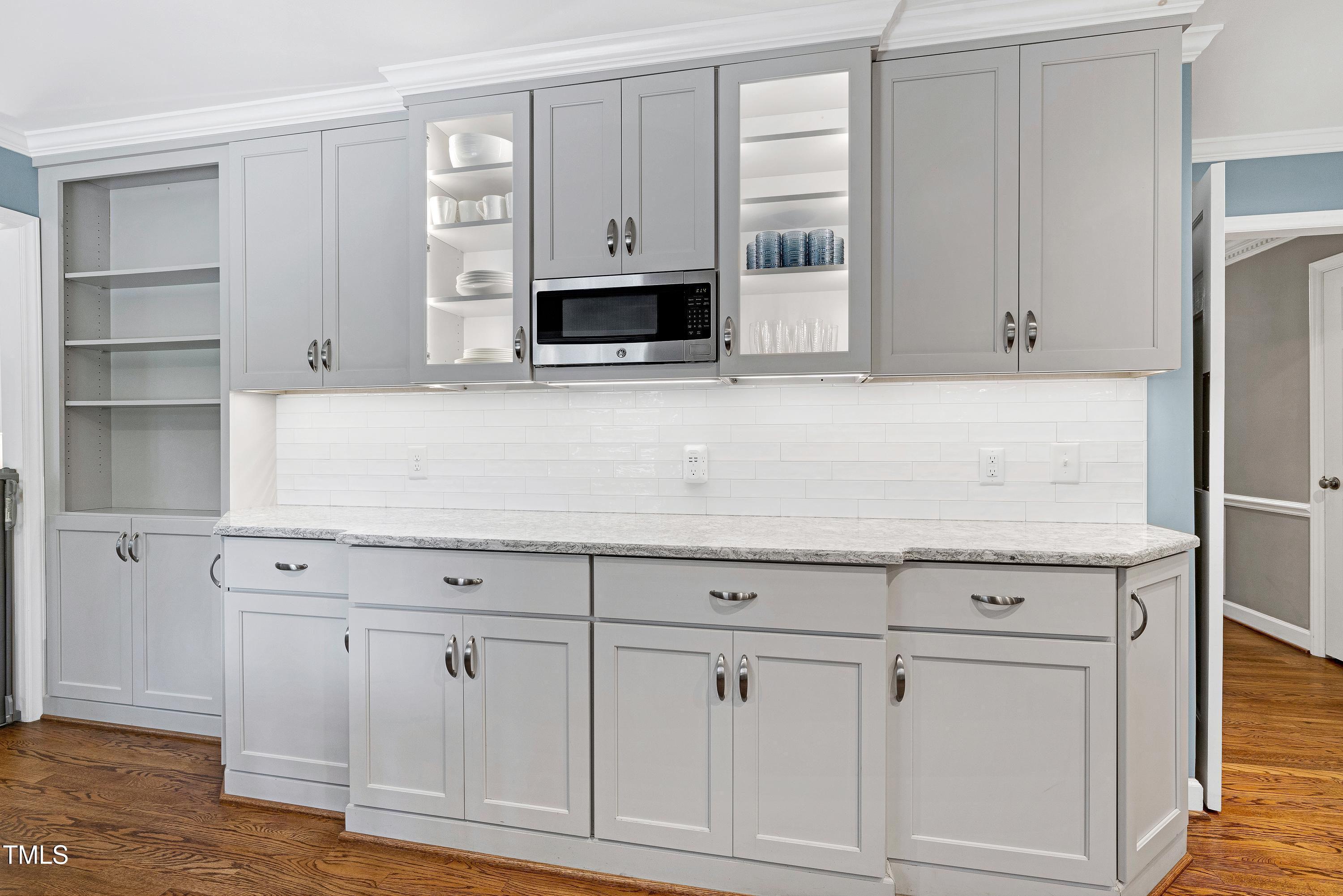 608 Misty Isle Place Raleigh, NC 27615 - Photo 33 of 75 a kitchen with white cabinets and a sink