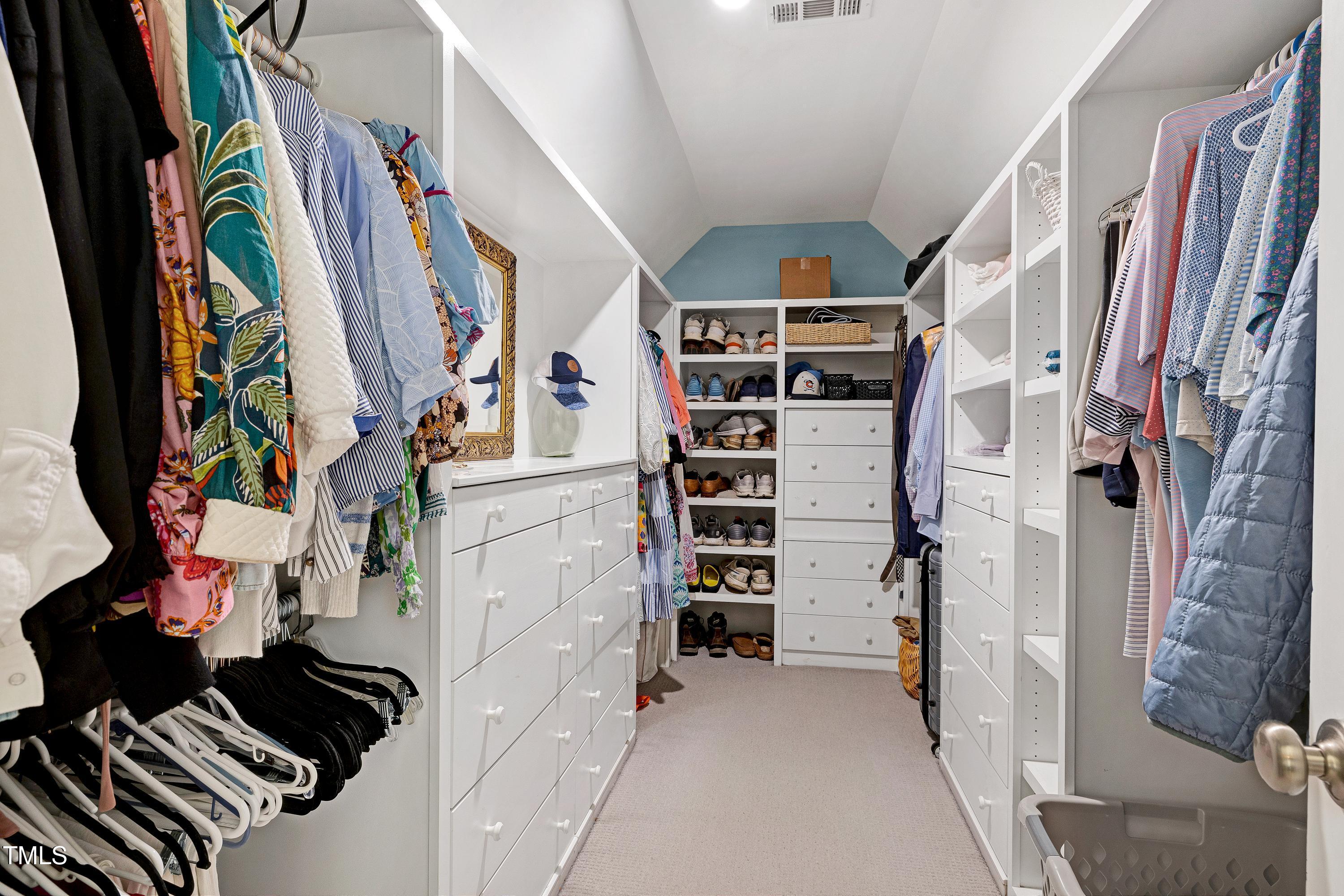 608 Misty Isle Place Raleigh, NC 27615 - Photo 47 of 75 a view of walk in closet with clothes and shoes