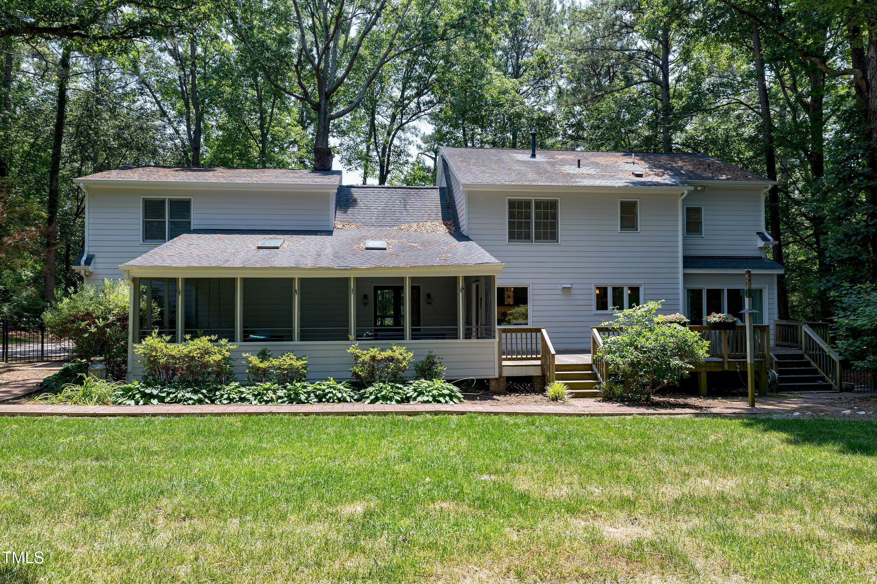 608 Misty Isle Place Raleigh, NC 27615 - Photo 66 of 75 a view of a house with a garden and plants