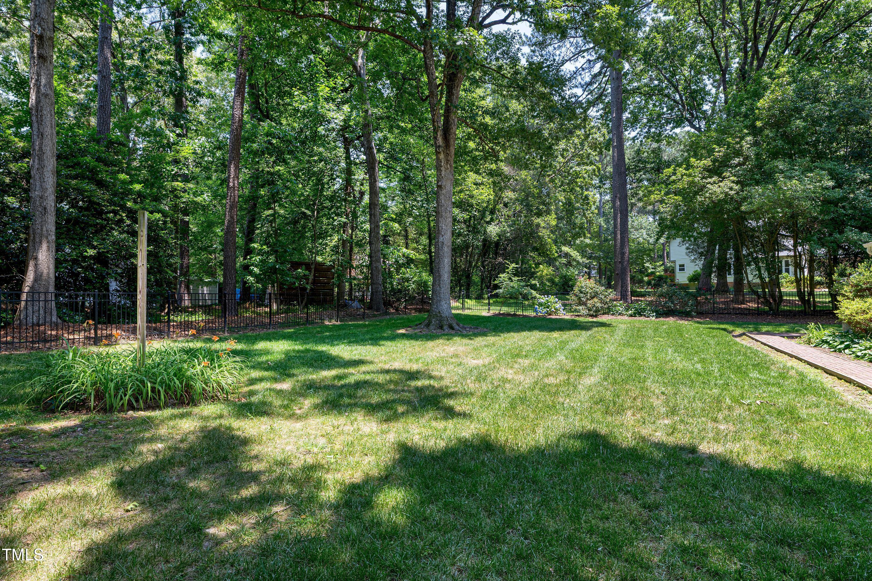 608 Misty Isle Place Raleigh, NC 27615 - Photo 68 of 75 a view of outdoor space with deck and yard
