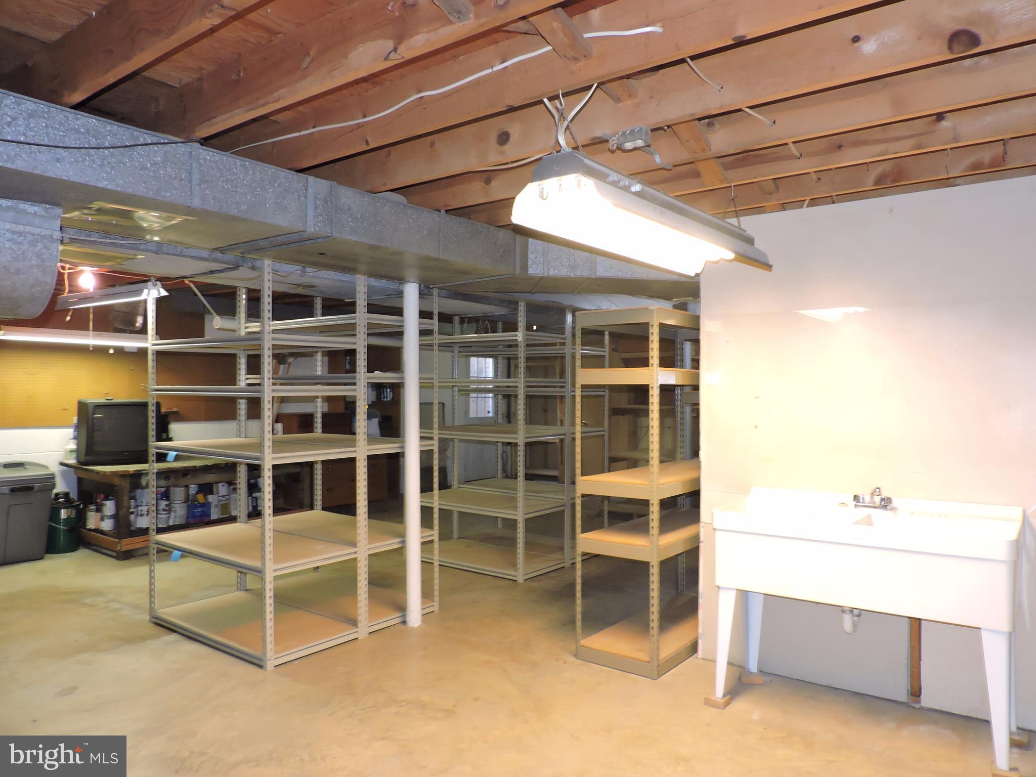 14129 Rippling Brook Drive Silver Spring, MD 20906 - Photo 20 of 25 Storage shelves ready! Utility sink for clean ups.