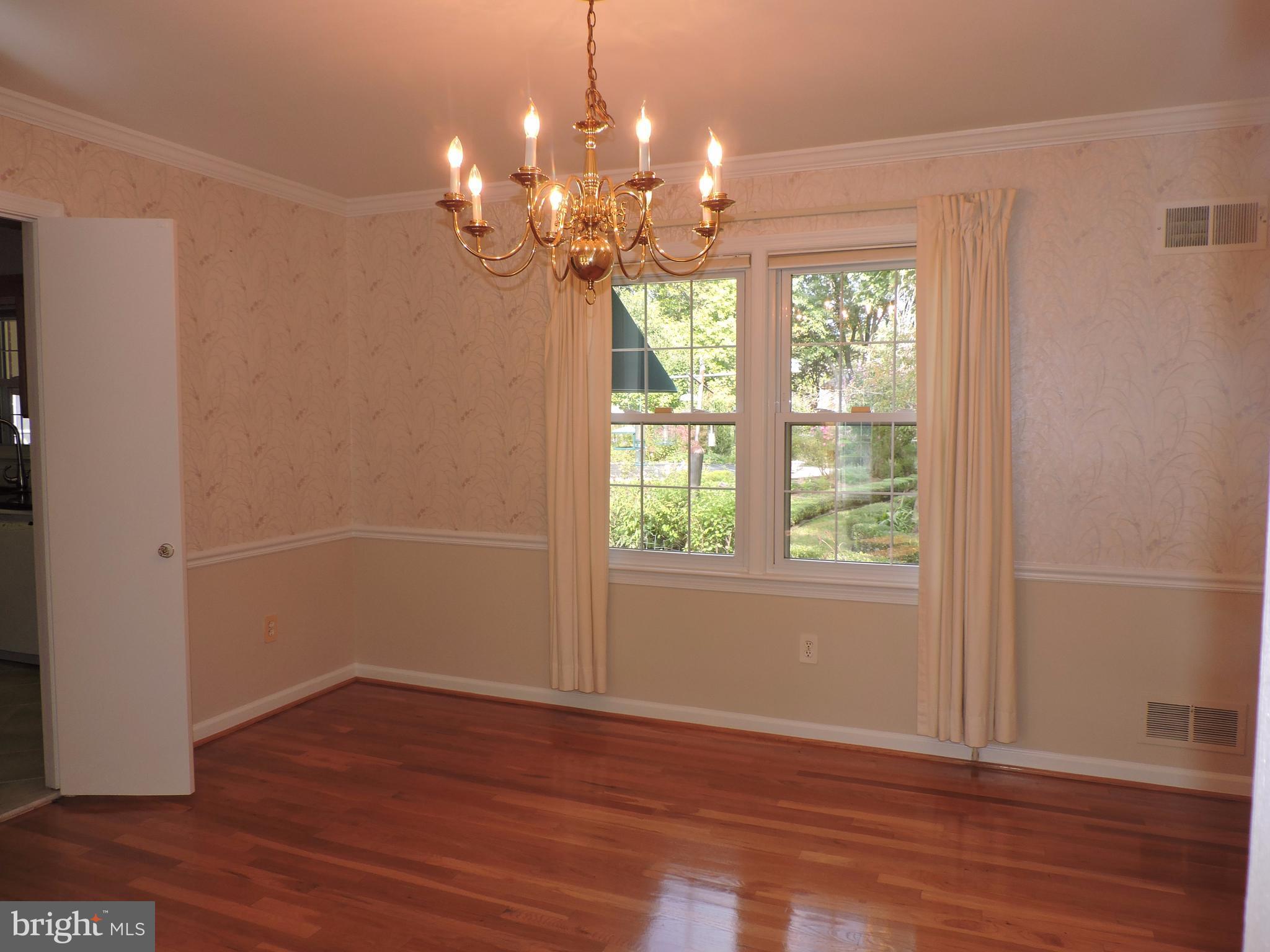 14129 Rippling Brook Drive Silver Spring, MD 20906 - Photo 6 of 25 Separate dining room with impressive chandelier