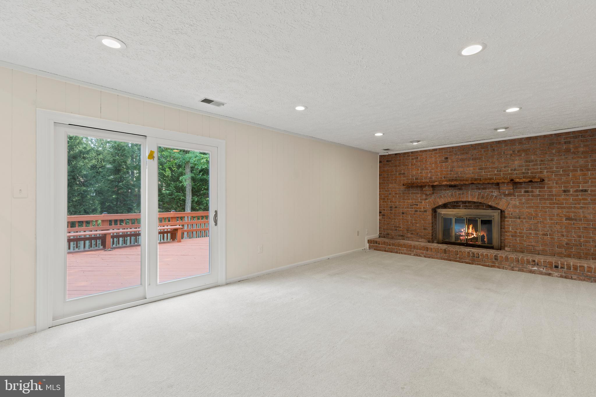 12209 Bayswater Road Gaithersburg, MD 20878 - Photo 17 of 53 Family room complete with fireplace & deck access