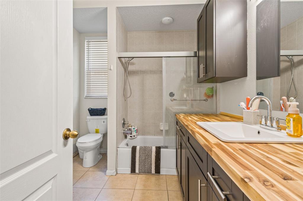11128 Lomita Wren Road Weeki Wachee, FL 34614 - Photo 15 of 39 a bathroom with a sink toilet and shower