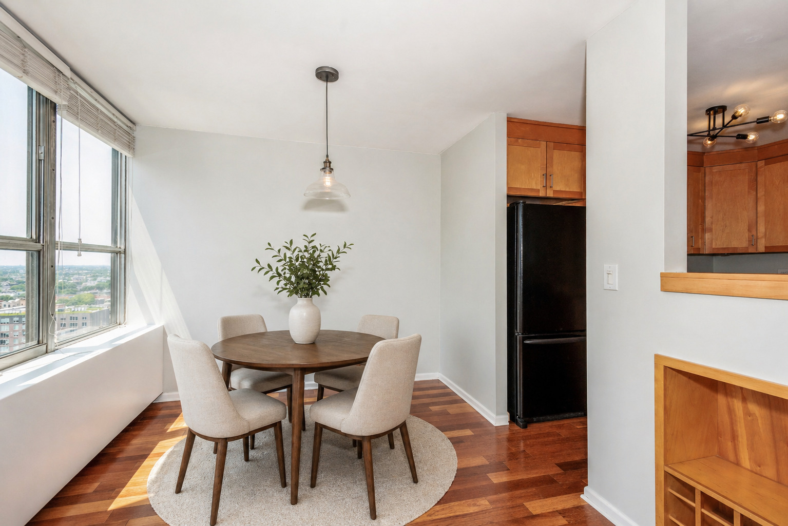 655 West Irving Park Road, Unit 1903 Chicago, IL 60613 - Photo 6 of 22 a dining room with furniture and window