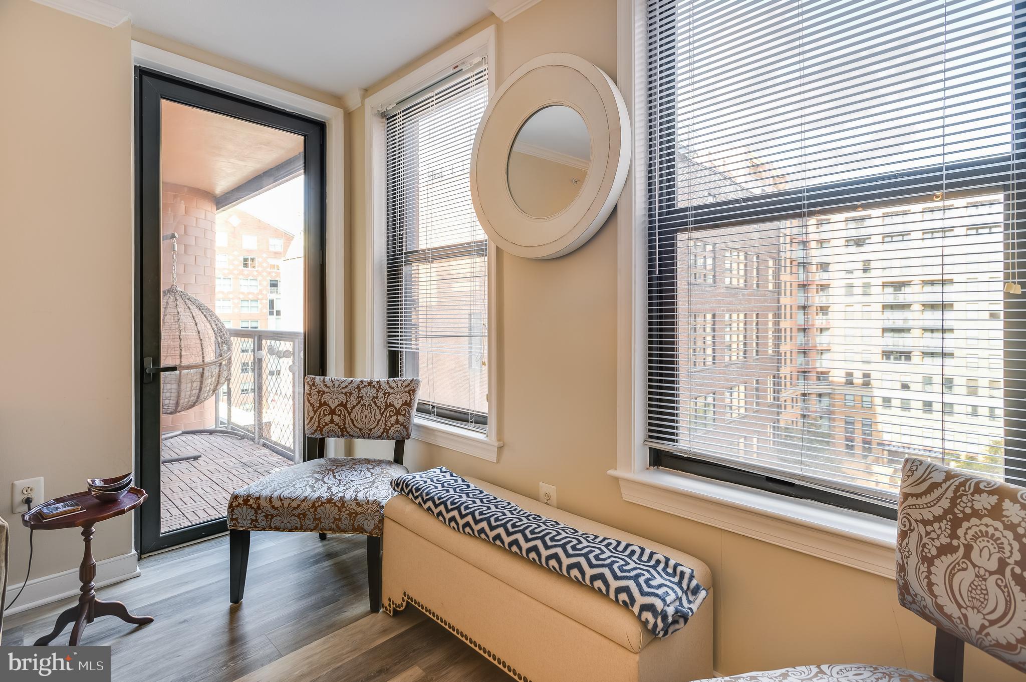 631 D Street Northwest, Unit 837 Washington, DC 20004 - Photo 5 of 29 a living room with furniture and a floor to ceiling window