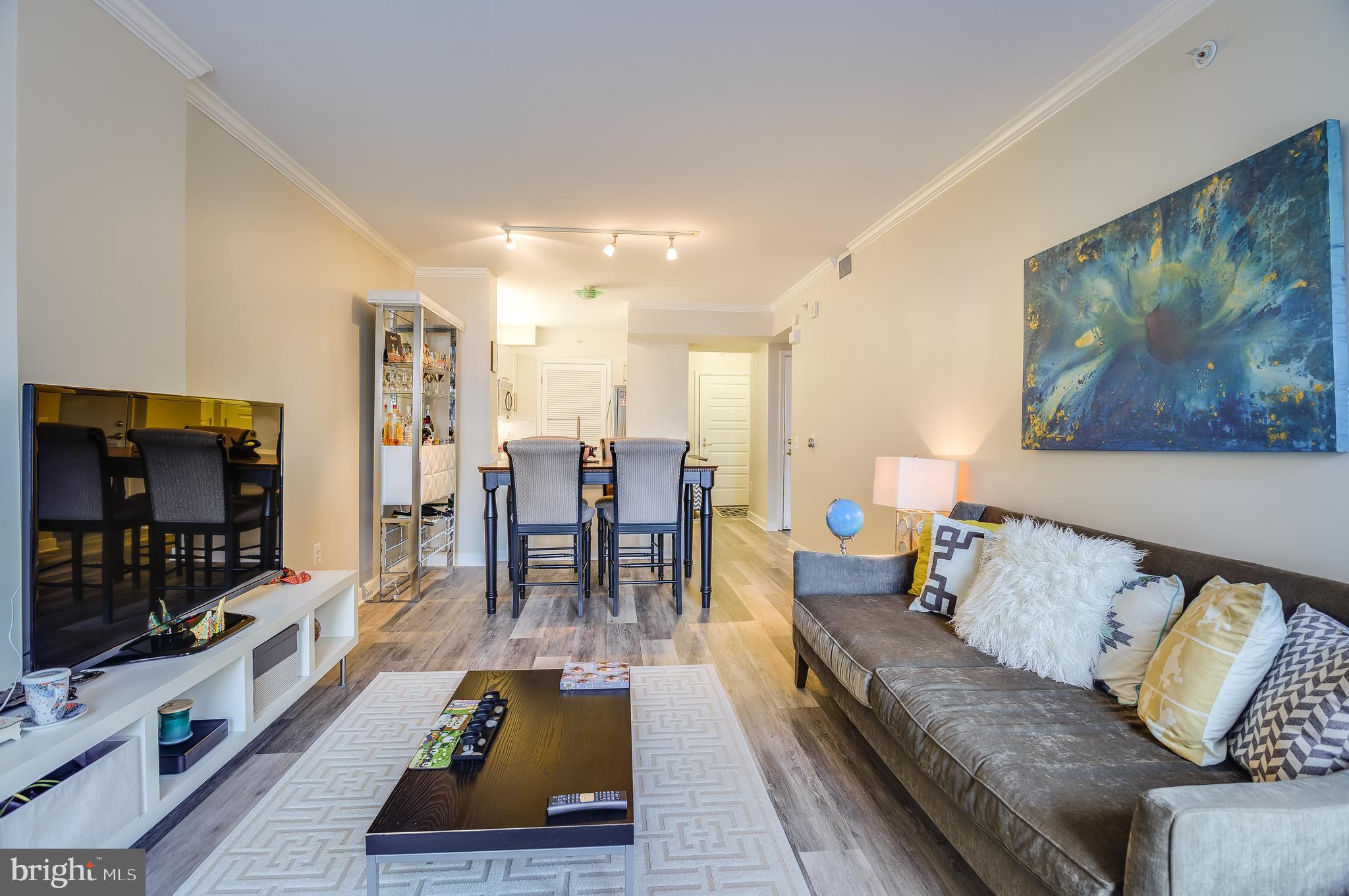 631 D Street Northwest, Unit 837 Washington, DC 20004 - Photo 7 of 29 a living room with furniture and a flat screen tv