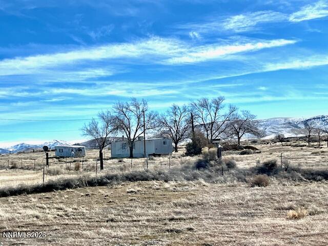100 Prince Royal Road Imlay, NV 89418 - Photo 1 of 5 a view of a yard with wooden fence