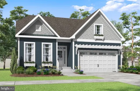 a view of a house with yard and plants