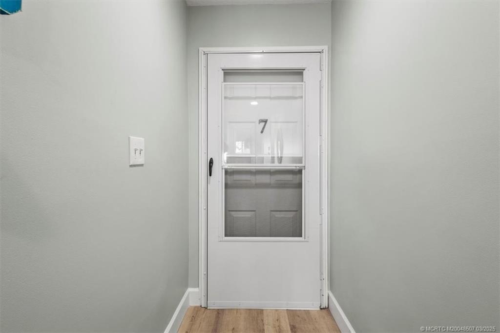 6082 Southeast Landing Way, Unit 7 Stuart, FL 34997 - Photo 36 of 36 Front Door Entrance / Interior