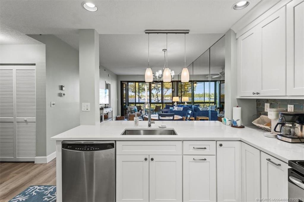 6082 Southeast Landing Way, Unit 7 Stuart, FL 34997 - Photo 5 of 36 Kitchen which overlooks the living / dining room.