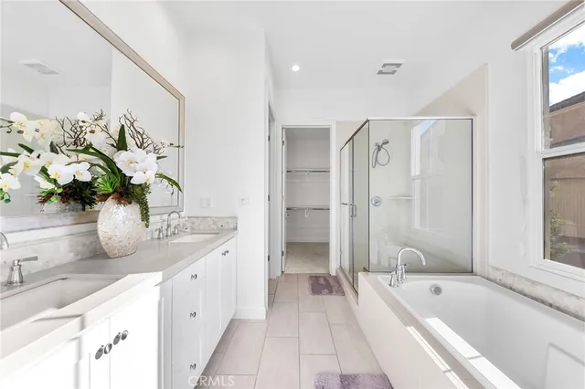 a bedroom with a bed and a night stand