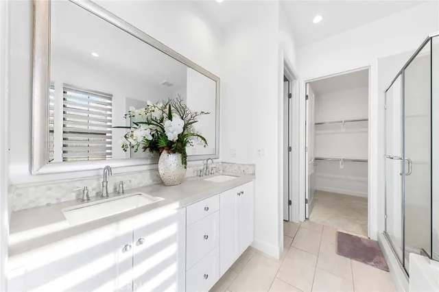 a view of a hallway with wooden floor and closet