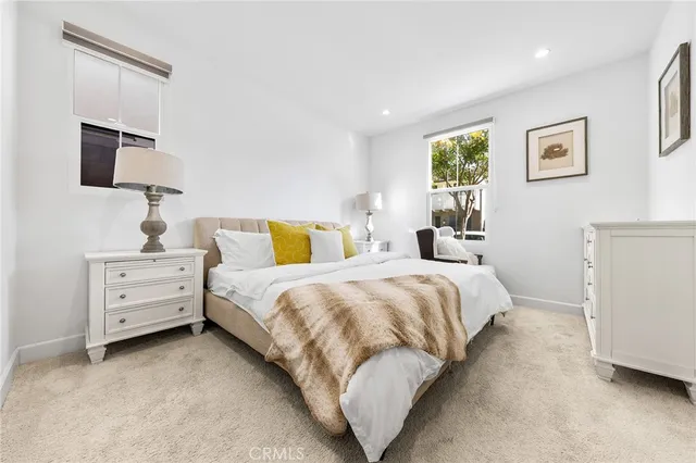 a living room with furniture and white walls
