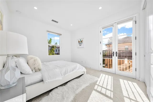 a house view with a sitting space and garden