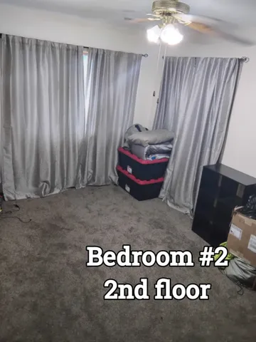 a bathroom with a toilet and shower