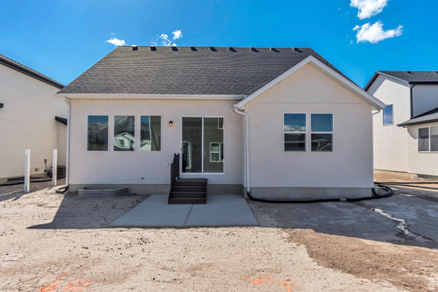 1302 1475 East, Unit 40 Payson, UT 84651 - Photo 31 of 34 Back of property featuring a shingled roof, stucco siding, entry steps, and a patio area