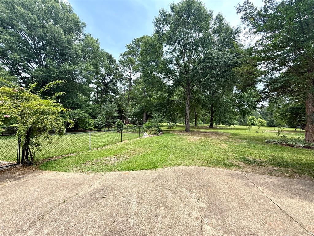 11535 Timber Ridge Drive Keithville, LA 71047 - Photo 37 of 39 a view of outdoor space with green field and trees