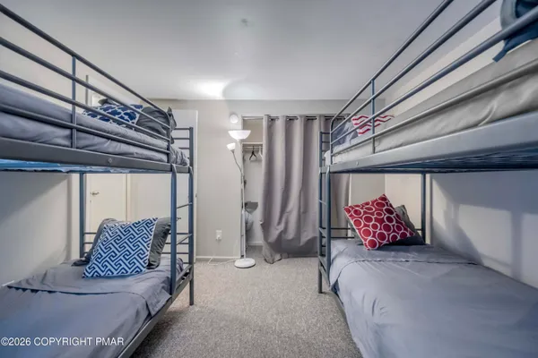 a bedroom with a bed and a walk in closet
