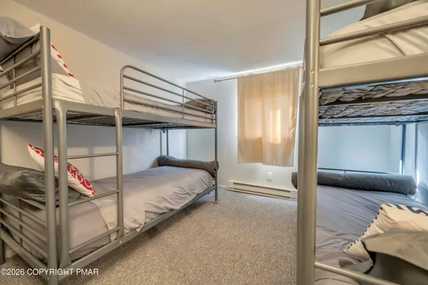 a bed room with a bed and balcony